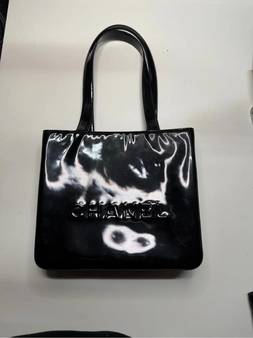 CHANEL Black Patent Leather Embossed Logo Tote